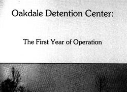[ai] A black and white image featuring the title "Oakdale Detention Center:" prominently displayed at the top, with the subtitle "The First Year of Operation" below it. The background includes faint outlines of trees.